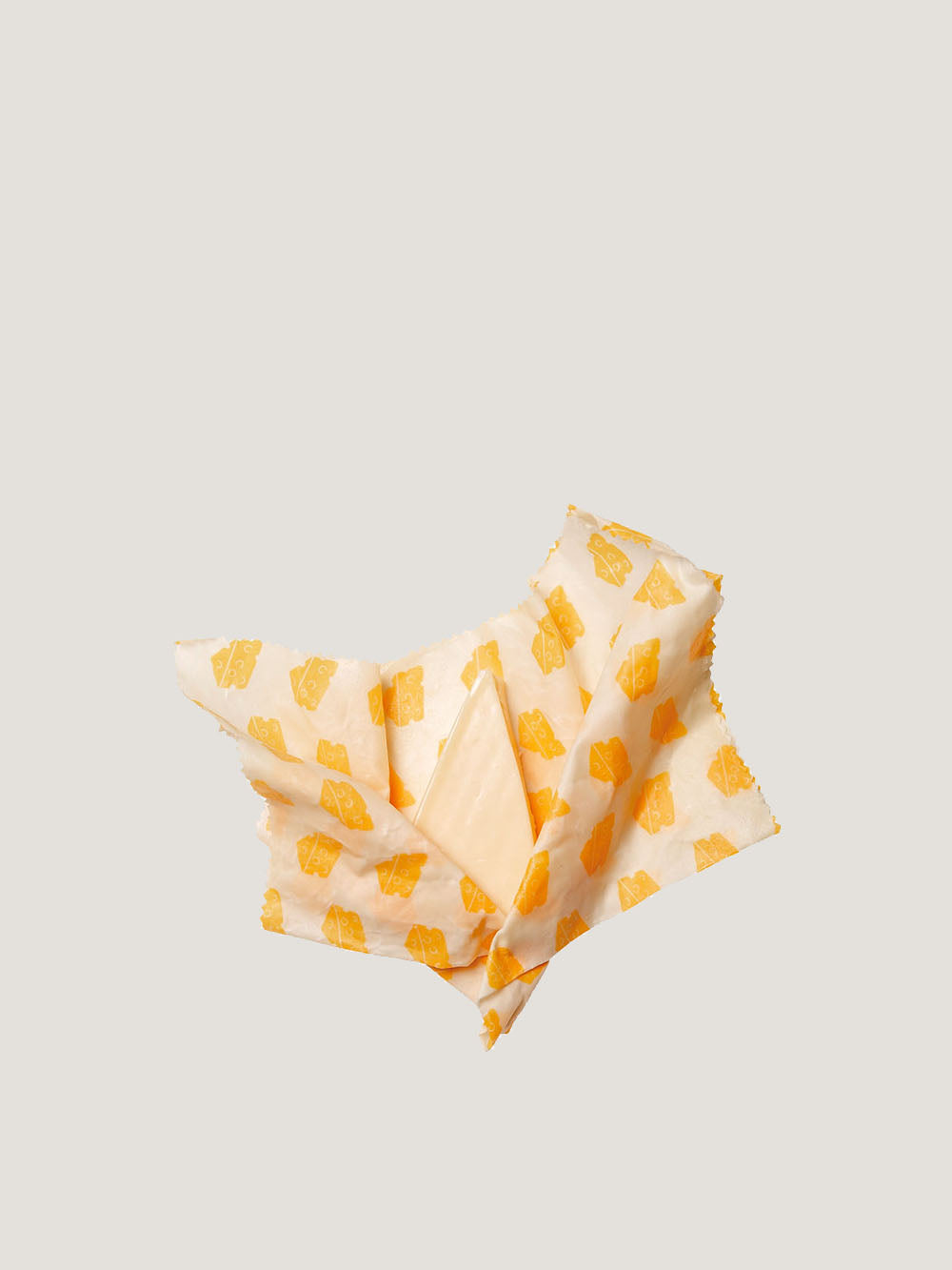 Ost pakket ind i bivokspapir